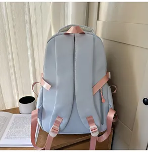 Sweet light blue school backpack with pink straps, casual daily daypack for students.