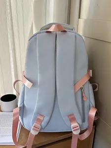 Light blue casual school backpack with pink straps, stylish and lightweight for students daily use.