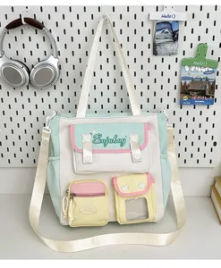 Japanese ins sweet style colorblock canvas crossbody bag with multiple pockets and shoulder strap.