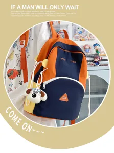 Cute color-blocking student backpack with dog pendant, large capacity travel school bag detail.
