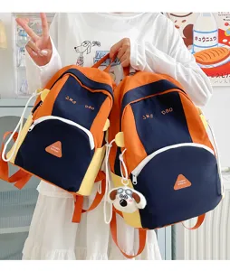 Cute color-block student backpack detail, large capacity nylon school bag with cute dog pendant.