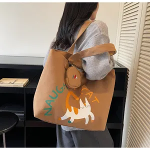 Canvas tote bag detail view showing cute cat print and large capacity for daily commuting.