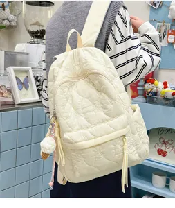 Sac à dos matelassé décontracté de style coréen pour l'école avec joli pendentif suspendu.