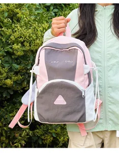 Cute color-block backpack for female students, stylish and large capacity travel bag.