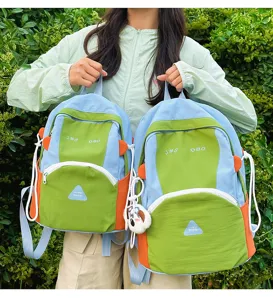 Cute colorblock backpack for women and students, large capacity travel school bag.