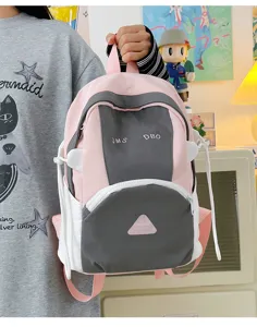 Cute color-block school backpack for women and students, large capacity casual travel bag.
