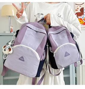 Close-up detail view of the cute color-blocking casual double shoulder backpack design.