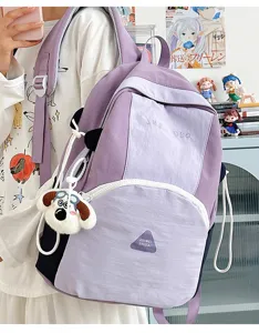 Cute purple colorblock backpack detail, spacious student bag with dog pendant and pockets.