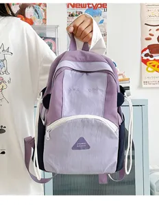 Detail view of the cute color-blocking student backpack, featuring spacious compartments and style.
