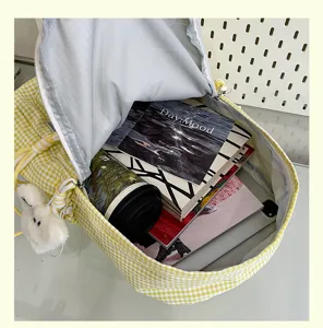 Yellow gingham school backpack detail shot, large capacity canvas casual daypack for students.