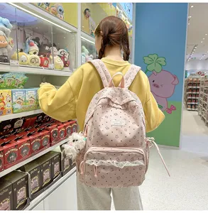 Pink corduroy backpack for teen girls, cute floral design with sweet lace trim student bag.