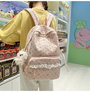 Pink corduroy backpack for teen girls, cute floral preppy style school bag with lace trim.