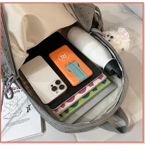 Corduroy backpack interior detail showcasing large storage capacity and neat daily organization.