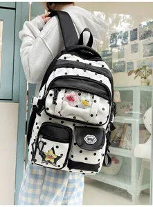Sac à dos ita à pois noirs et blancs avec poche transparente et adorables pendentifs étoiles.