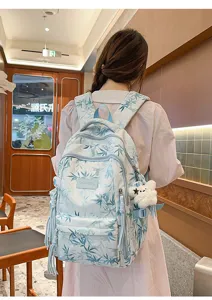 Bamboo print canvas student backpack with large capacity and multiple pockets for travel.