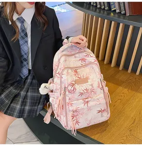 Pink bamboo leaf print student backpack with multiple pockets, casual daily travel daypack.