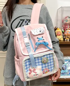 Cute Japanese ita backpack for women, pink school bookbag with clear front pocket and cute charms.