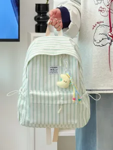 Japanese ins style minimalist large capacity striped canvas backpack for daily use.