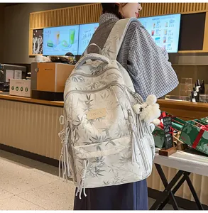 Detailed lifestyle view of the Chinese style bamboo leaf printed multi-pocket canvas backpack.