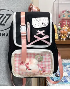 Cute Japanese anime ita bag for students, stylish black backpack with clear window and plush bunny.