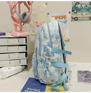 Blue bamboo leaf print student backpack, large capacity multi-pocket casual double shoulder bag for travel.