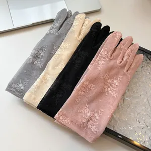 Detailed view of women summer lace sun protection gloves, breathable mesh floral design.