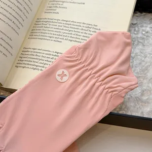 Detail shot of pink ice silk sunscreen gloves, featuring a chic cutout logo and soft fabric.