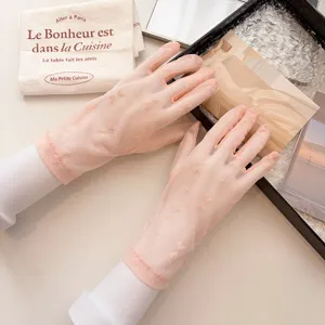 Detailed close up of pink mesh lace sunscreen gloves for women summer breathable