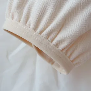 Close-up of soft warm fleece sleeve cuff with elastic band and cozy herringbone texture.