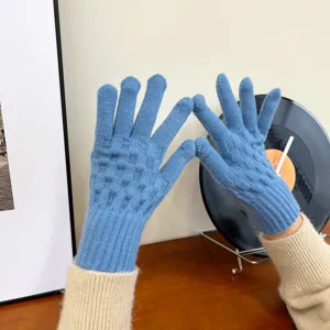 Women's winter knitted warm gloves detail view, stylish blue solid color cozy thermal accessory.