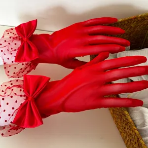 Red polka dot mesh bow gloves detail, elegant lace wedding party dress accessory.