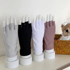 Women half finger sun protection gloves detail display, breathable solid color short style summer wear.