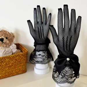 Black fishnet lace gloves detail showing delicate bow decoration and floral lace cuffs.