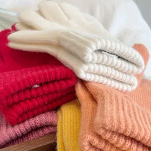 Colorful knit gloves detail showing soft texture and cozy winter design for couples.