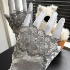 Lace half-finger gloves detail shot, breathable summer design for dance and fashion.
