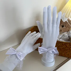 White lace mesh gloves with satin bows, breathable sheer sun protection wedding party gloves.