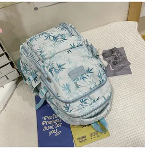 Detailed view of large capacity Chinese style bamboo leaf printed canvas student school backpack.