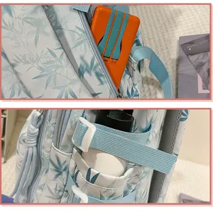 Detail view of student bamboo leaf print backpack showing front pocket and side straps clearly.