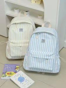Close-up of ins-style striped backpack showing durable fabric, neat stitching and front pocket.