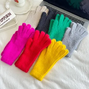 Detailed view of colorful fuzzy winter gloves, soft warm material, multi-color display scene.