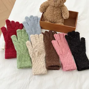 Women thick warm knit touchscreen gloves in multiple colors displayed nicely with teddy bear.