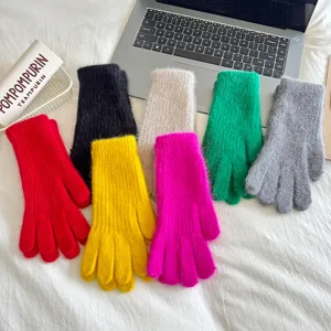Detailed view of colorful plush knit gloves for women winter warmth and daily wear.
