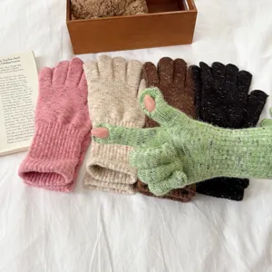 Detailed view of women autumn winter speckled knit touchscreen gloves in multiple colors.