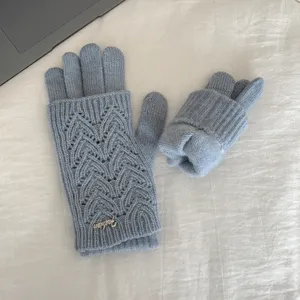 Detailed view of women's winter knit gloves, hollow-out texture, layered design, soft and warm.