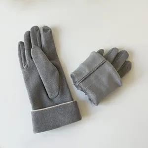 Detail shot of women winter thermal touch screen gloves showing thick plush inner lining and velvet.