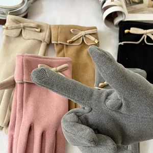 Detailed view of women thermal touch screen gloves featuring bow and soft fleece interior.