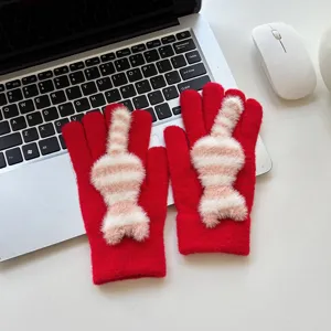 Detailed view of cute striped cat winter warm gloves, soft knitted thermal fabric for women.