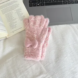 Cozy pink faux mink fleece winter gloves featuring a cute bow detail and touch screen design.