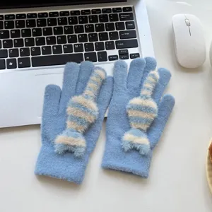 Cute blue knitted gloves with fluffy striped cat tail design for warm winter daily wear.