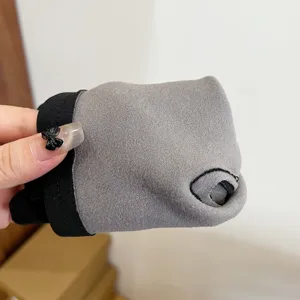 Close-up detail shot of men's thermal fleece gloves featuring soft grey fabric and thumb hole.